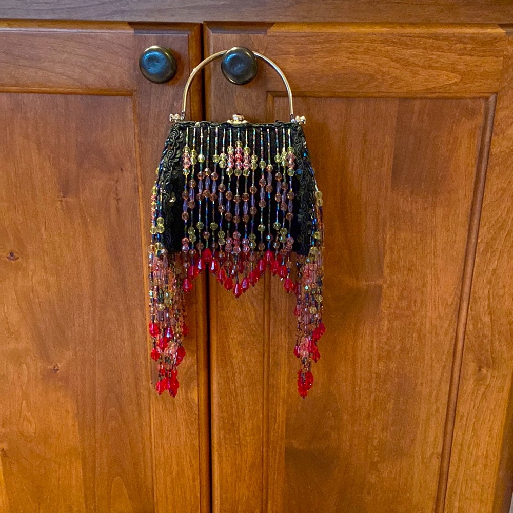 Very unique evening bag with beaded overlay on velvet background, chrome handle.